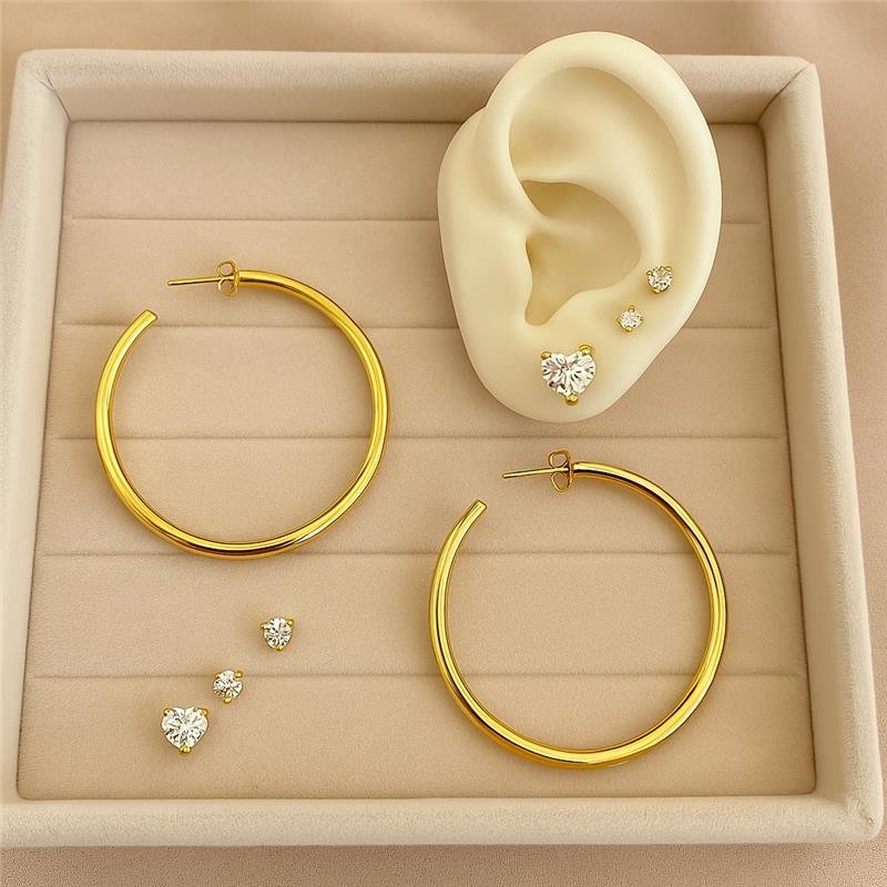 BRINCO TRIO CORAÇÃO ZIRCÔNIA E PONTO DE LUZ BANHO OURO 18K