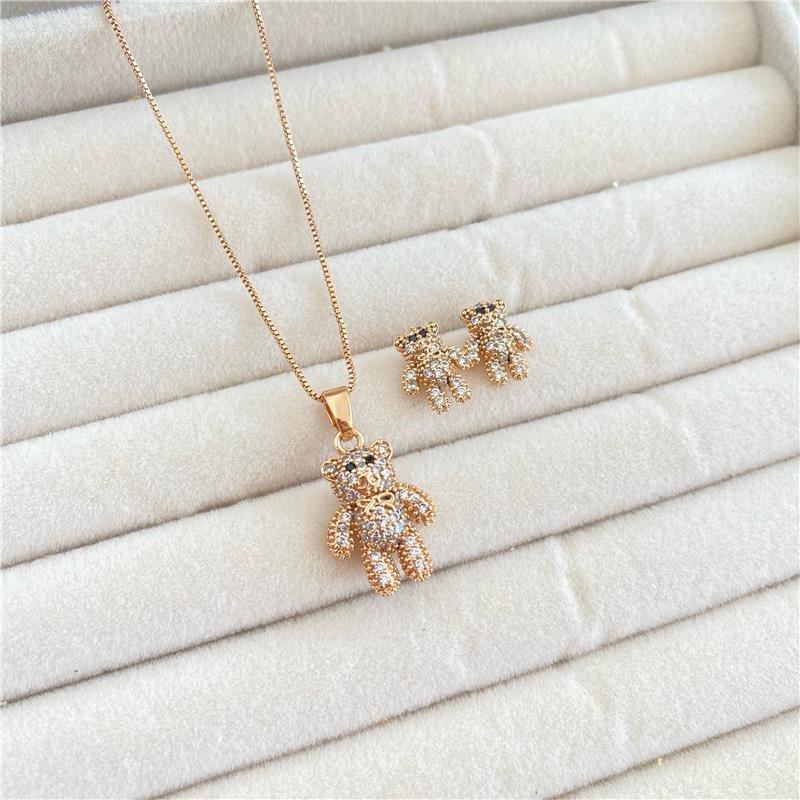 CONJUNTO URSO CRAVEJADO BANHO OURO 18K