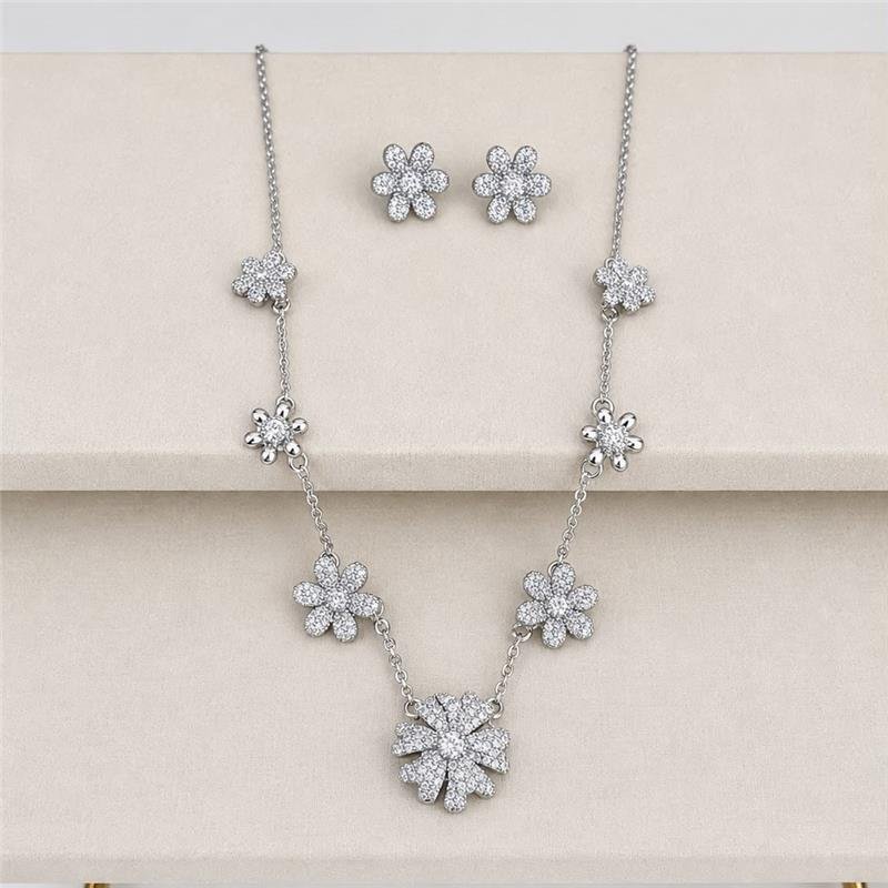 CONJUNTO FLORES CRAVEJADAS COM PONTO DE LUZ BANHO PRATA950