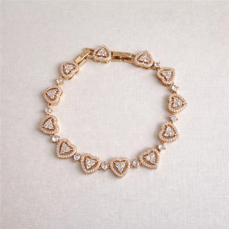PULSEIRA CORAÇÕES CRAVEJADOS E PONTO DE LUZ BANHO OURO 18K 