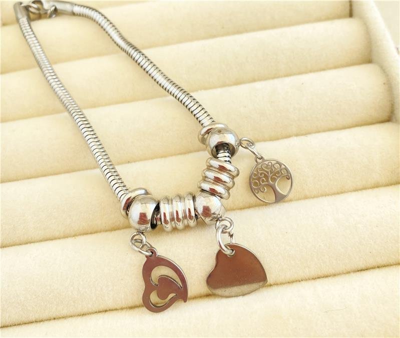 PULSEIRA DREAMS COM BERLOQUE CORAÇÃO E ÁRVORE DA VIDA EM AÇO INOXIDÁVEL