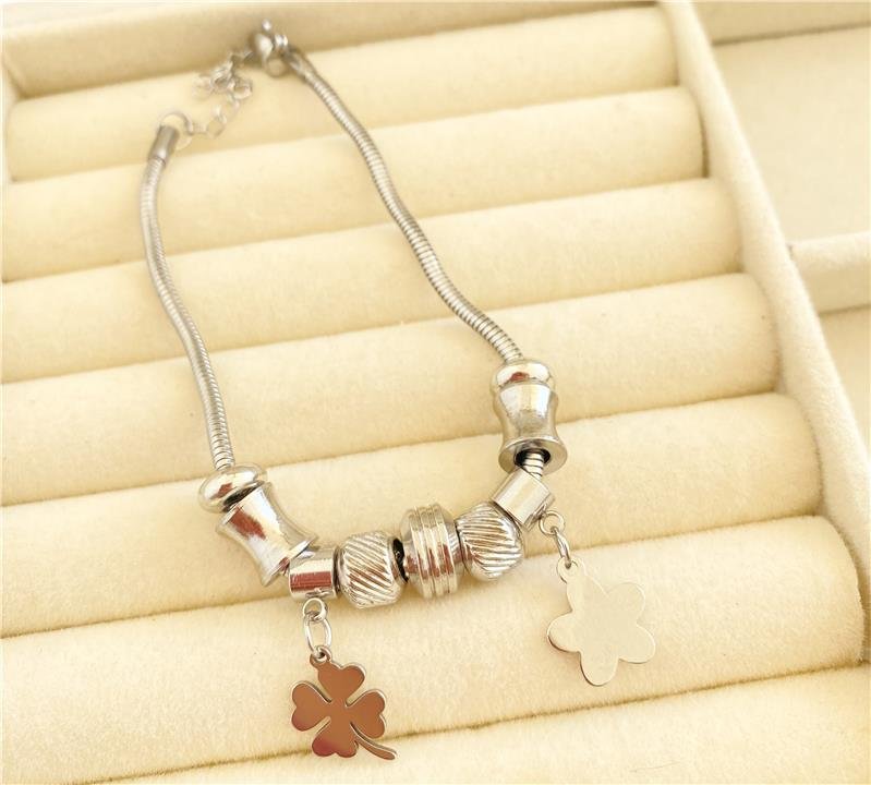 PULSEIRA DREAMS COM BERLOQUE TREVO E ESTRELA EM AÇO INOXIDÁVEL