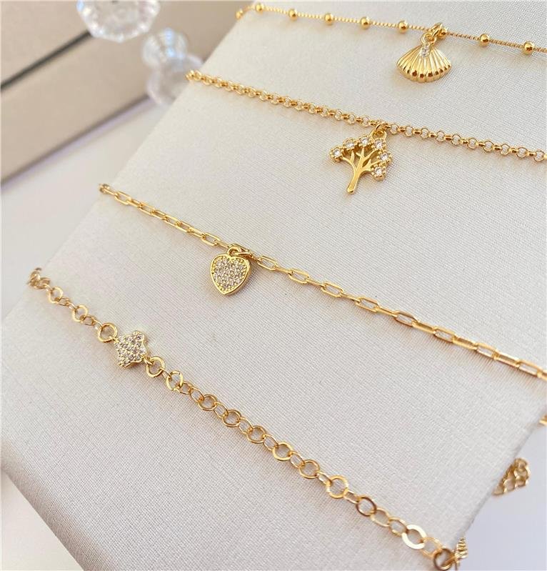 TORNOZELEIRA PINGENTE CONCHA COQUEIRO E ESTRELA BANHO OURO 18K